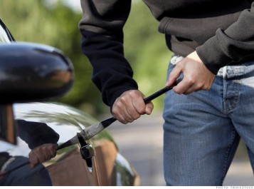 Man breaking into car